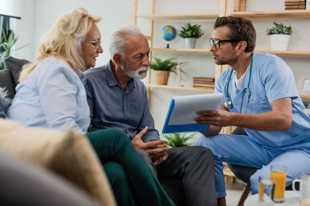 Nurse and caregiver discussing an individualized home care plan in New York City