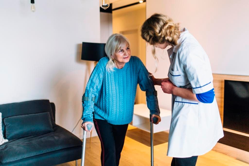Home health aide assisting with post-hospital recovery care in New York City