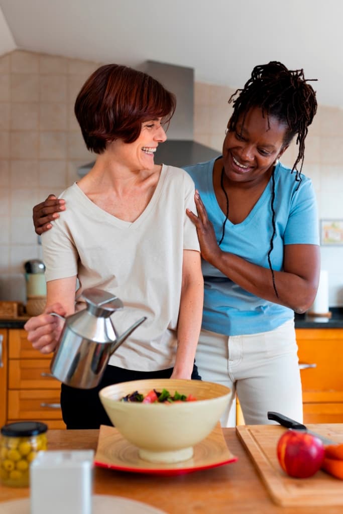 Live-in caregiver assisting an older adult safely at home in NYC