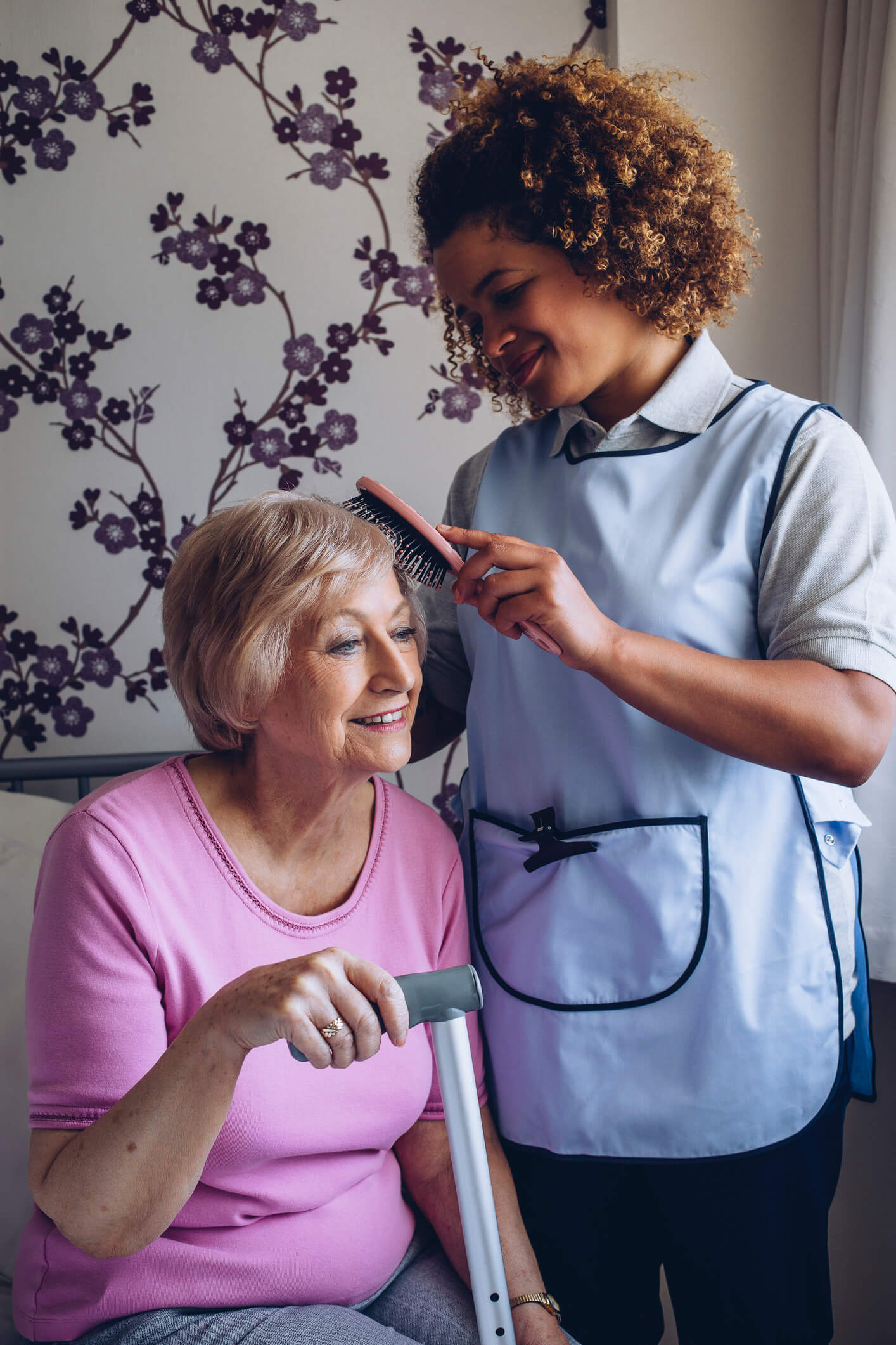 Carer Brushing Patients Hair